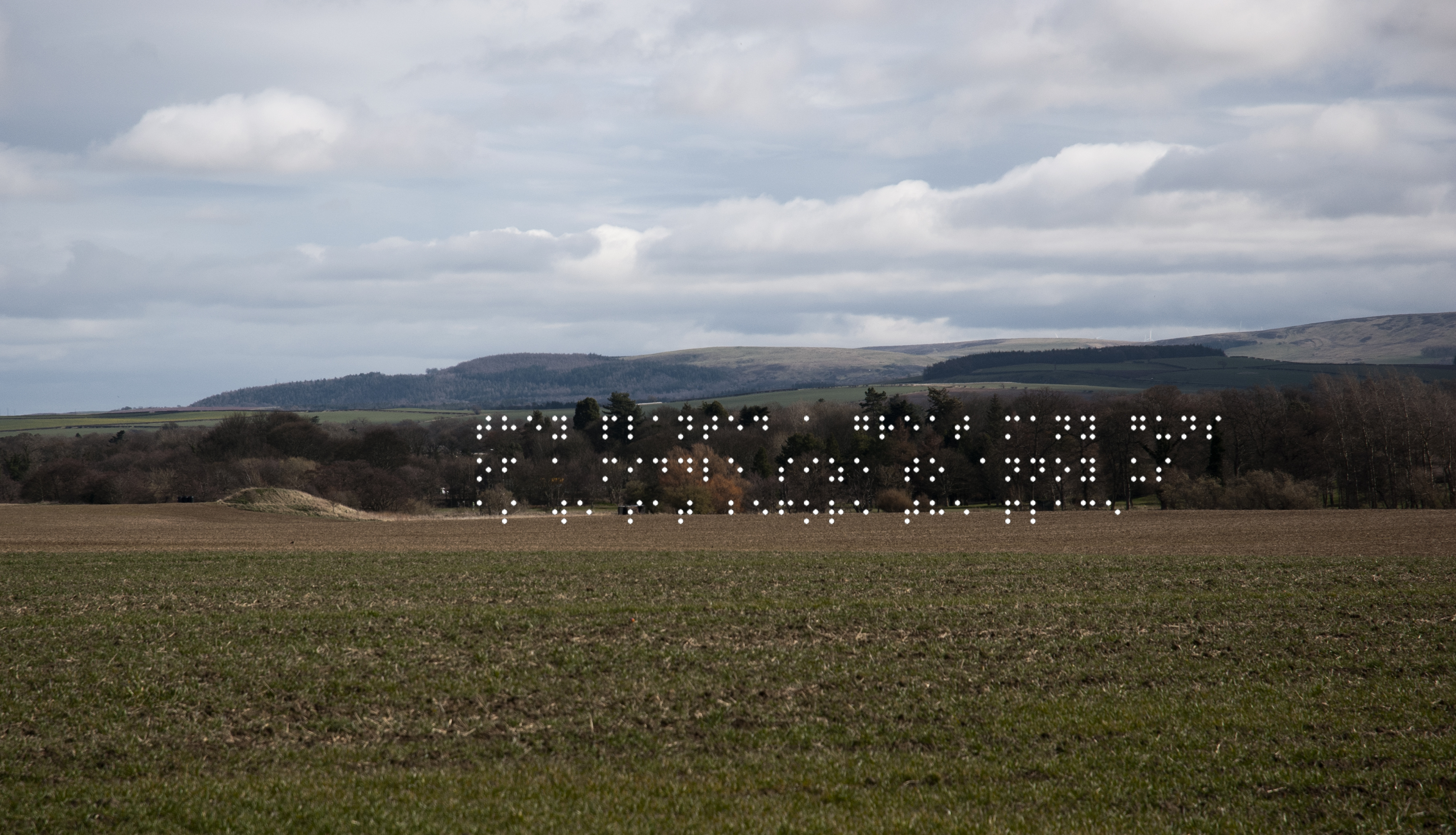 Farmed field with mound of earth. Mound was cannon platfrom. Quote taken from historical figure shown in Braille