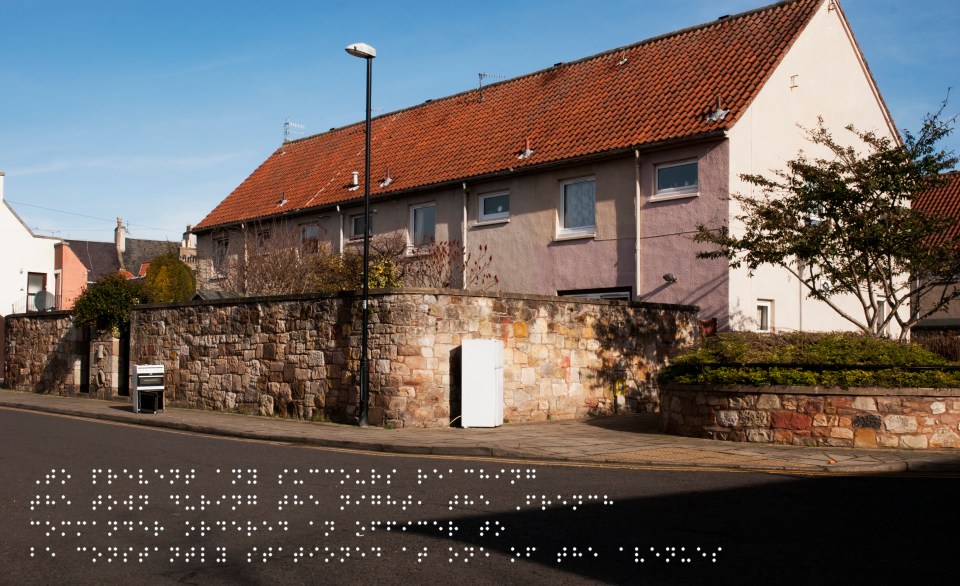 New housing but with fridge and cooker abandoned in the street. Quote taken from historical figure shown in Braille